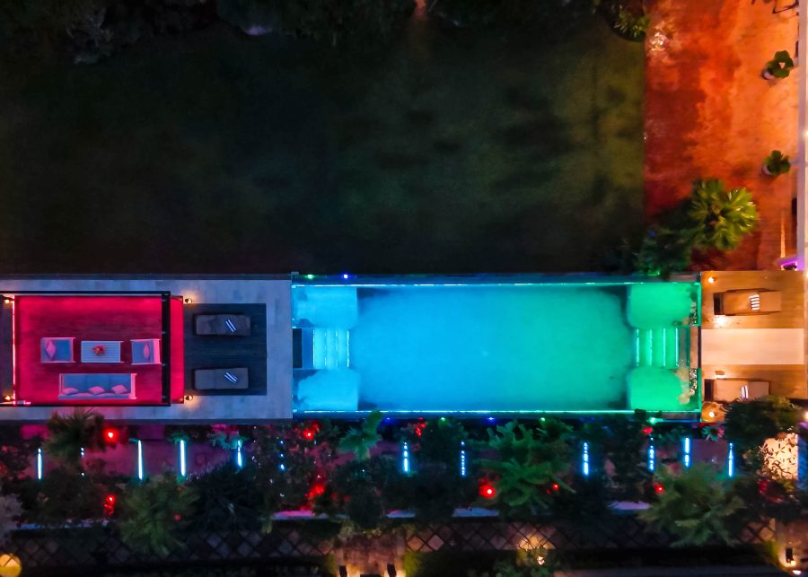 Aerial view of The Lilly Pad swimming pool and outdoor terrace at night