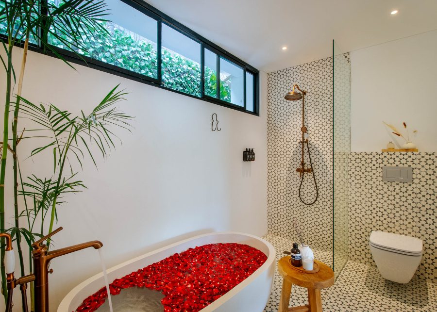 Bathroom with Freestanding bathtub and shower at Villa Yang in Canggu