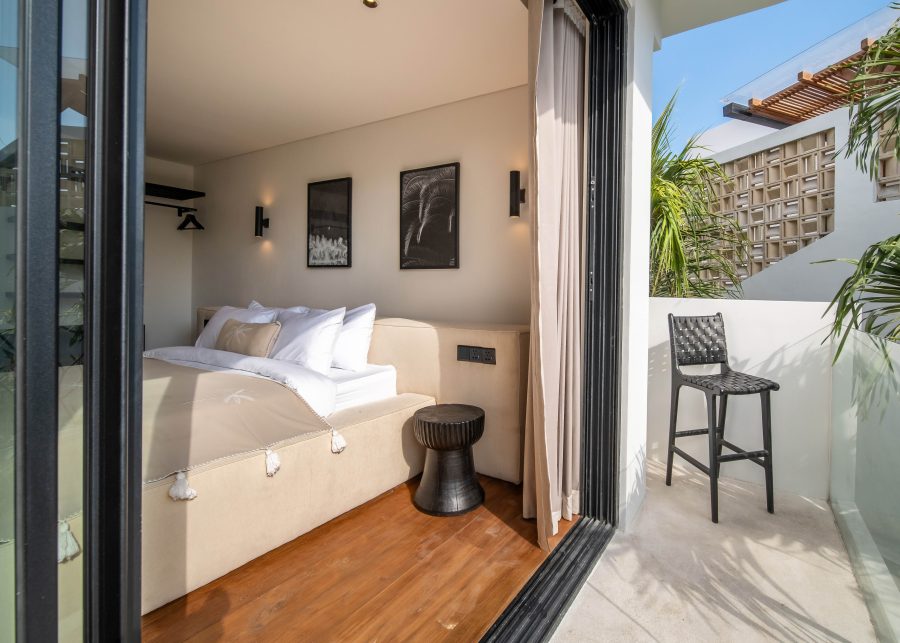 Bedroom and balcony at Ibai Villas in Berawa