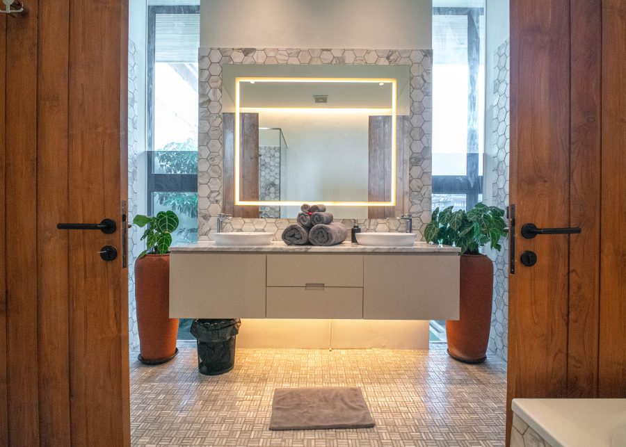 Designer bathroom with wooden doors and top quality lighting