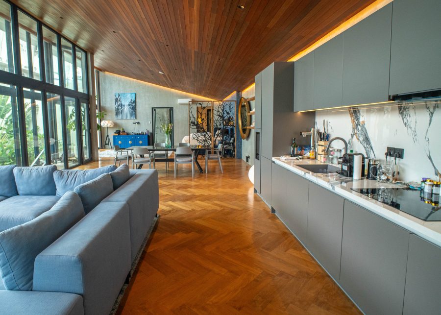 Living area with 9 metre high ceilings and reclaimed teak wood flooring