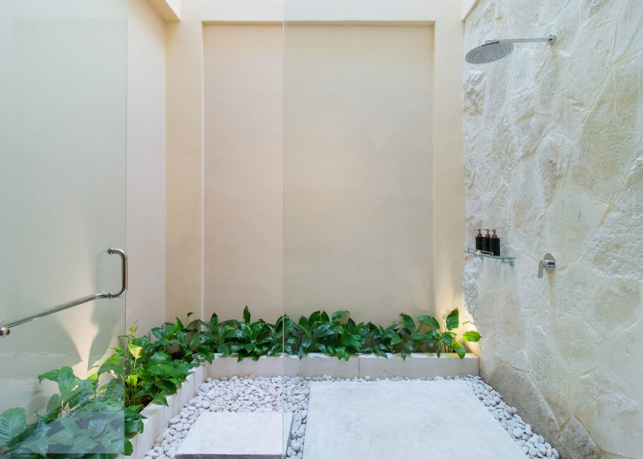 Outdoor shower constructed from stone at Villa Josuloma in Bali