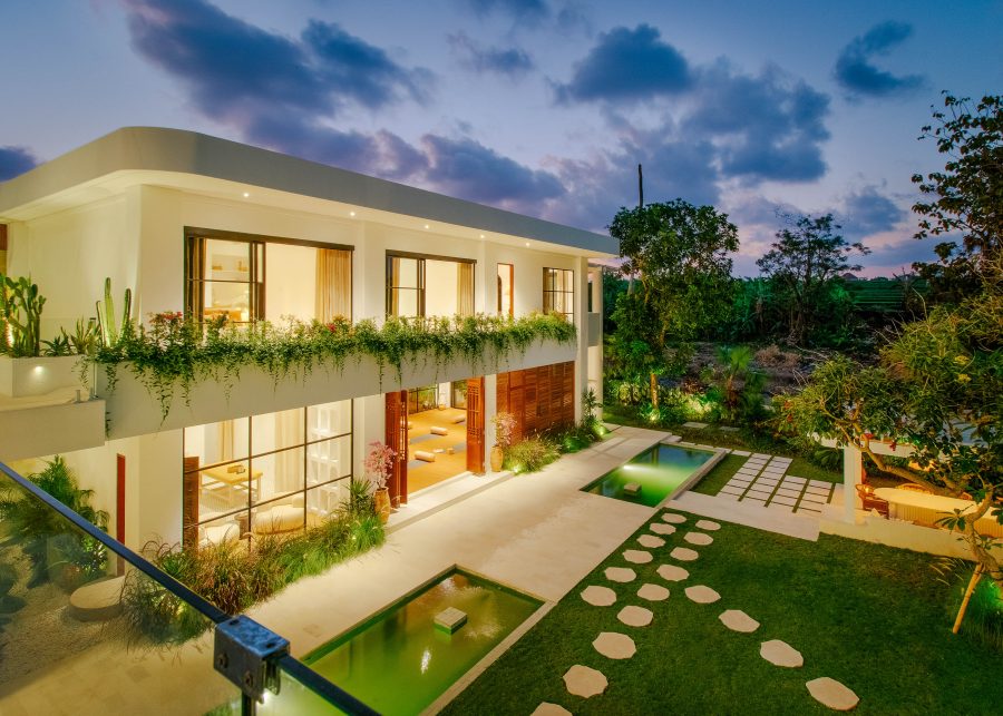 The luxury villa, Villa Yang, at night with stunning lighting, built by Construct Bali